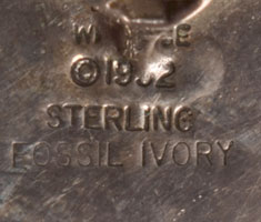 Artist signature of Denise Wallace Chugach/Aleut Jeweler