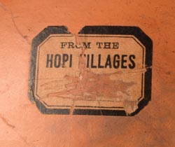 The underside bears a partial “Hopi Villages” paper label, which was originally used by the Fred Harvey Company in the early 20th century to promote and sell Native American pottery and crafts to tourists traveling the Santa Fe Railway. While the label alone does not confirm authorship, it is often associated with pottery made by Nampeyo and other recognized artists who supplied work to Harvey’s Indian Department. The underside bears a partial “Hopi Villages” paper label, which was originally used by the Fred Harvey Company in the early 20th century to promote and sell Native American pottery and crafts to tourists traveling the Santa Fe Railway. While the label alone does not confirm authorship, it is often associated with pottery made by Nampeyo and other recognized artists who supplied work to Harvey’s Indian Department.