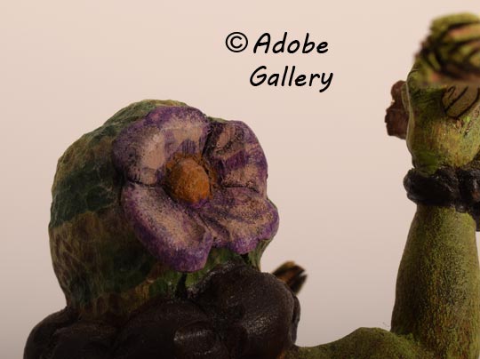 Close up view of the squash blossom of the back of the head.