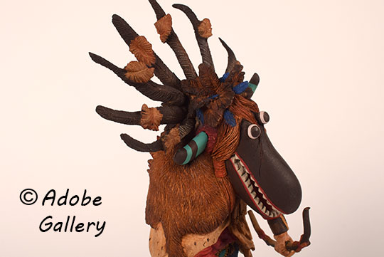 Close up view of the face of this figurine.