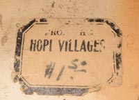 The underside bears a partial "Hopi Villages" paper label, which was originally used by the Fred Harvey Company in the early 20th century to promote and sell Native American pottery and crafts to tourists traveling the Santa Fe Railway. While the label alone does not confirm authorship, it is often associated with pottery made by Nampeyo and other recognized artists who supplied work to Harvey's Indian Department.