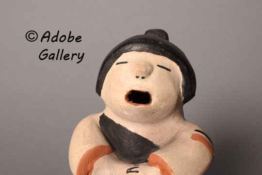 Close up view of the face of this figurine. Close up view of the face of this figurine.