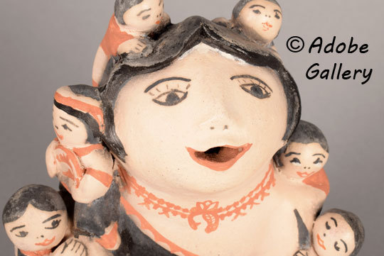 Close up view of the face of this figurine. Close up view of the face of this figurine.