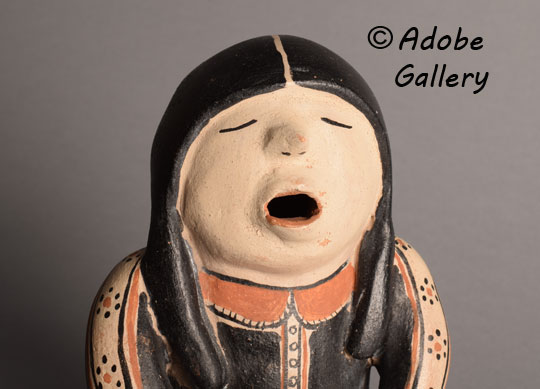 Close up view of the face of this figurine. Close up view of the face of this figurine.
