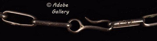 A simple hook and loop design secures this necklace. A simple hook and loop design secures this necklace.
