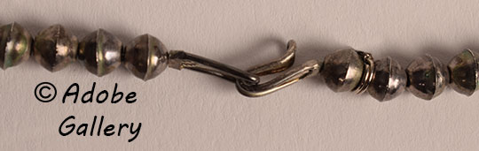 A simple hook and loop design secures this necklace.