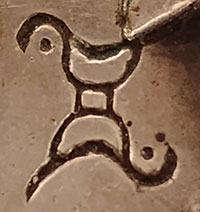 Artist hallmark signature of Mike Bird-Romero, Ohkay Owingeh Pueblo Silversmith.