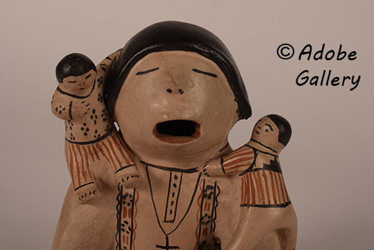 Close up view of the face of this figurine.
