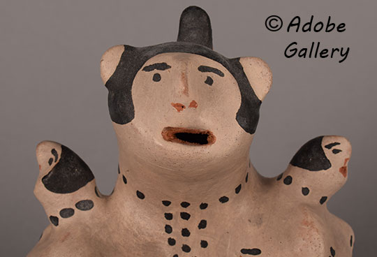 Close up of the face of this figurine.