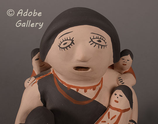 Close up view of the face of this figurine. Close up view of the face of this figurine.