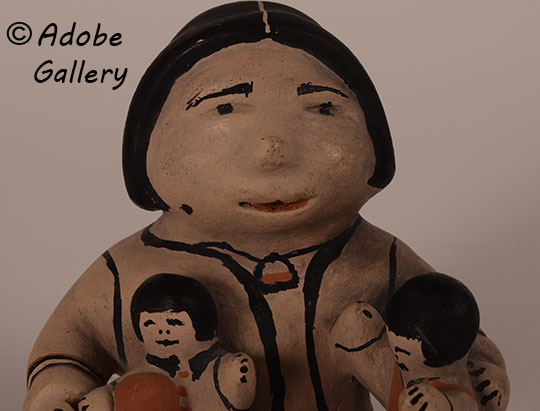 Close up view of the face of this figurine. Close up view of the face of this figurine.