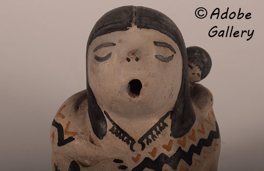 Close up view of the face of this figurine. Close up view of the face of this figurine.