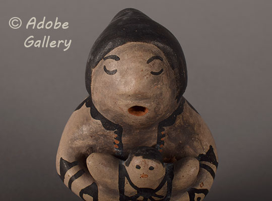 Close up view of the face of this figurine. Close up view of the face of this figurine.