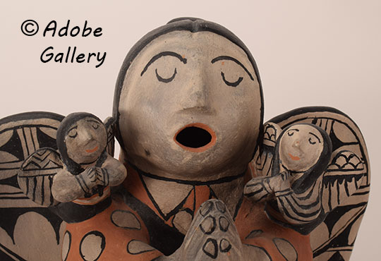 Close up view of the face of this figurine.