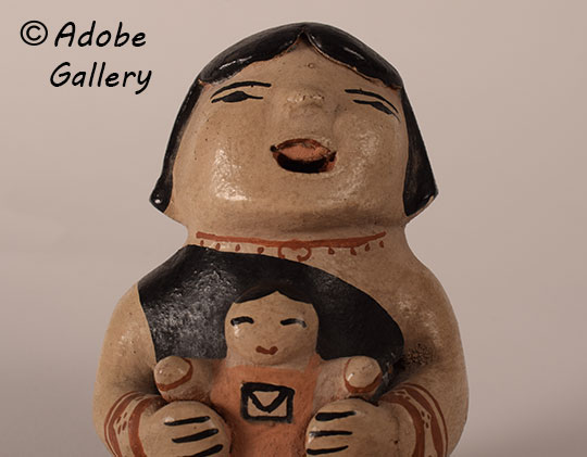 Alternate close-up view of this pottery figurine.