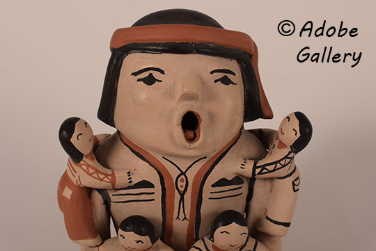 Close up view of the face of this figurine. Close up view of the face of this figurine.