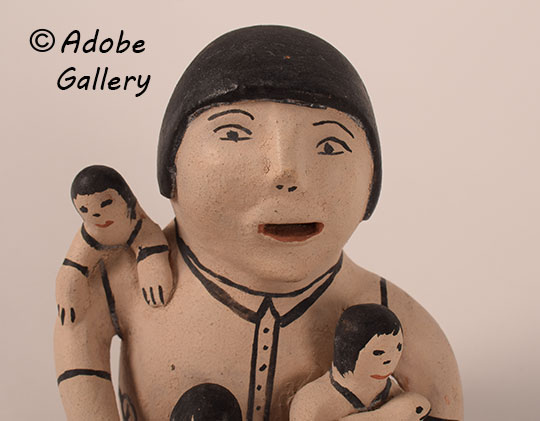 Close up view of the face of this figurine. Close up view of the face of this figurine.