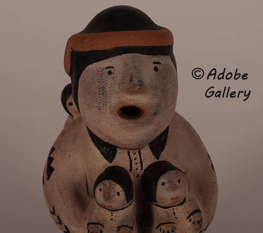 Close up view of the face of this figurine. Close up view of the face of this figurine.