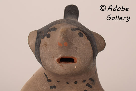 Alternate close-up view of this pottery figurine. Alternate close-up view of this pottery figurine.