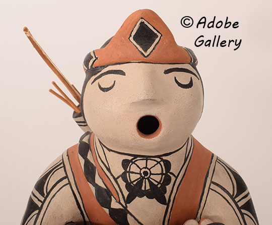 Close up view of the face of this figurine. Close up view of the face of this figurine.