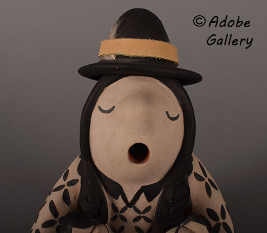 Close up view of the face of this figurine. Close up view of the face of this figurine.