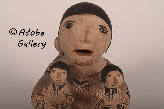 Close up view of the face of this figurine. Close up view of the face of this figurine.