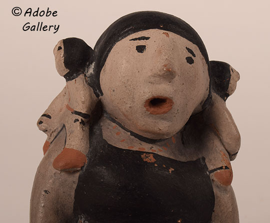 Close up view of the face of this figurine. Close up view of the face of this figurine.