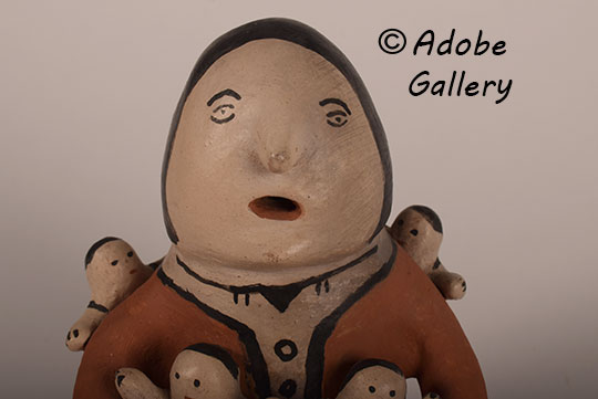 Close up view of the face of this figurine. Close up view of the face of this figurine.