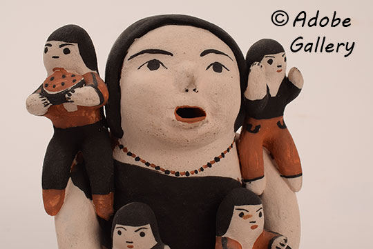 Close up view of the face of this figurine.