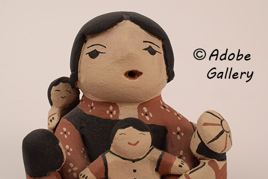 Close up view of the face of this figurine. Close up view of the face of this figurine.