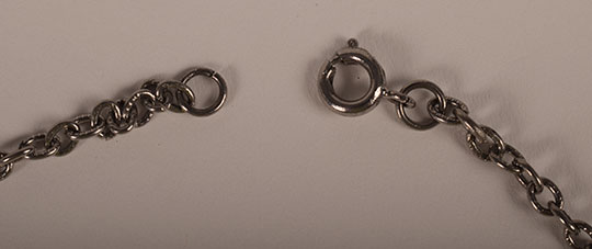 A simple hook and loop design secures this necklace.