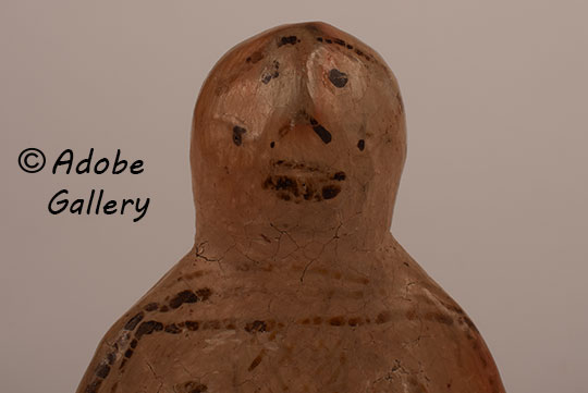 Close up view of the face of this figurine. Close up view of the face of this figurine.