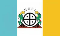 The flag of the Hopi Nation is used by the Native American Hopi people of Arizona in the United States who live on the Hopi Reservation. The flag is a vertical tricolor of turquoise, white, and yellow, with the Hopi symbol in the middle.  The flag is accompanied by a red fringe.  