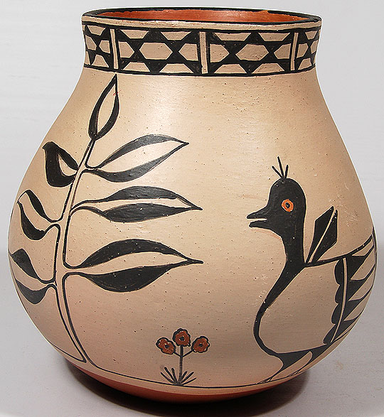 This absolutely wonderful jar by Alvina Garcia features two charming birds among flowers and foliage. The bentonite slip is smooth and creamy and the black designs are strong and bold. She placed the traditional "star" design around the neck of the jar and stone polished the red slip on the interior of the neck.   Condition: The jar is in original excellent condition Provenance: ex. coll. Frances Sonnenberg, Santa Fe resident.