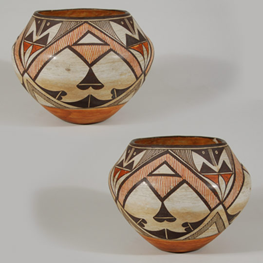 Designs on pueblo pottery were influenced by many outside sources starting as early at the mid-1800s. Floral elements, birds, deer, and other designs could easily have been influenced by Spanish colcha designs as well as pottery designs from Mexico. It was also evident that potters borrowed designs from pueblos other than their own.   The heartline deer design was first seen at Zuni Pueblo, but later appeared on pottery from Acoma, Laguna and Zia Pueblos. Intermarriage between pueblos also contributed to designs appearing where they never appeared before.   This Acoma jar is completely covered with Zuni design elements. The orange/red fine lines in the A-frame areas are most typically Zuni in origin. The entire layout of the design is typical of Zuni arrangement, yet the pot is from Acoma Pueblo. It is not as thin-walled as Acoma pottery generally is so it is possible that a transplant potter from Zuni or another pueblo moved to Acoma and practiced the art of making Acoma pottery but had not yet achieved the expertise of creating thin walls.   The jar is a beautiful example of a well formed vessel and a beautifully arranged design. It is in excellent condition.