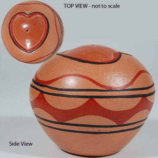 The potter carved into the top center of this jar, a beautifully shaped heart, which is stone polished slip, and outlined it in deep red with a further outline of black.  The design on the mid-body is a traditional design seen on Zia dough bowls.   I have not been able to find a reference to the potter but perhaps she had connections to Zia Pueblo prior to moving to Jemez, possibly as a result of marriage.  At any rate, she is a fine potter.  The jar is signed with the potter's name and 2/14/88.  Perhaps it was a Valentine gift to Mrs. Rust, the current owner.   Condition: original condition Provenance:  from the collection of Katherine H. Rust