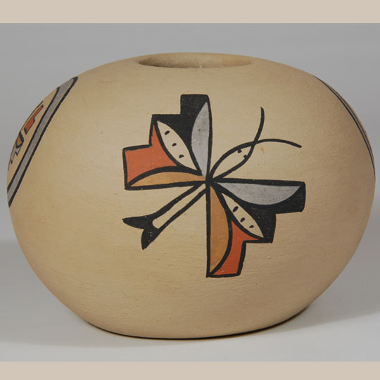 Mary Gutierrez is a member of the Talachy family of Pojoaque Pueblo but I have been unable to find any significant information regarding her.  One would assume that she was related to Minnie Vigil and Lois Gutierrez because their style of pottery is similar in shape, design, and finish, but I can find no connection between them.  This seed jar was most likely made in the 1960s as that is when most of the pottery in this collection was purchased.   Condition:   original condition with the exception of a small adhesive mark where a piece of tape was removed near the base of the jar.   Provenance: from the collection of Katherine H. Rust